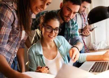 TasklyHub Featured Blog Image of HR Team Working At Desk