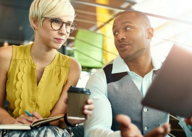 TasklyHub Featured Blog Image of Two HR Team Members Talking