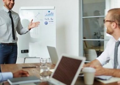 TasklyHub Featured Blog Image of Sales Manager Presenting